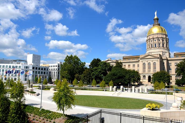 Picture of Liberty Plaza in the foreground and the State Capitol in the background.